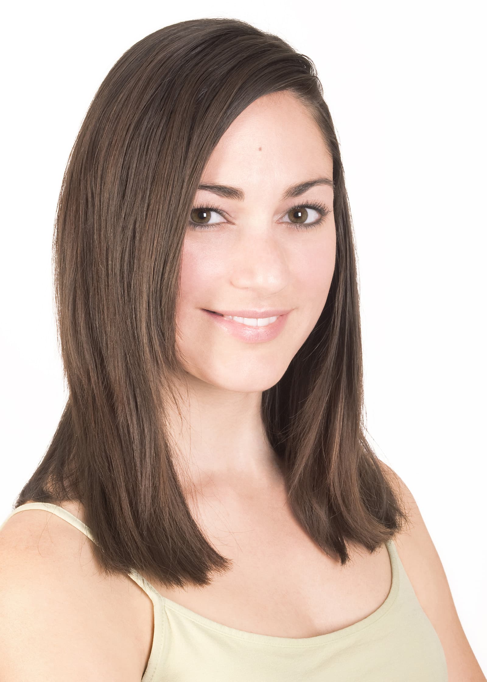 Professional studio headshot of a woman with long brown hair on a clean white background, photographed in Tampa.